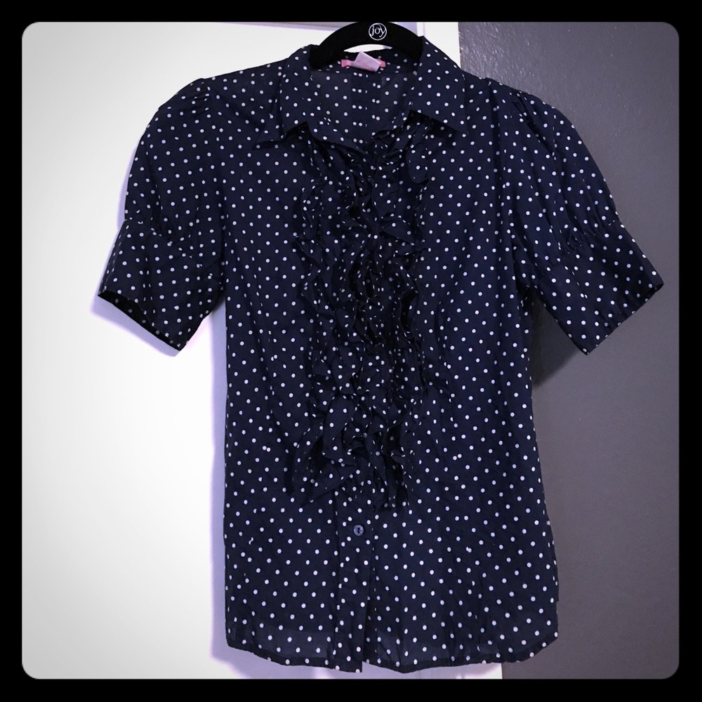 Navy polka dot ruffled blouse
